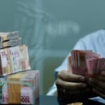 1763693705_ilustrasi-mata-uang-rupiah-3_169.jpeg