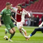 2025-12-02-15-51-33-amsterdam-mika-godts-of-afc-ajax-opweg-naar-de-1-0-dies-janse-of-fc-groningen-fc.webp
