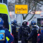 german-police-officers-stand-together-during-a-demonstration-against-the-planned-re-founding-of-the.webp