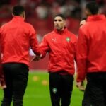 morocco-s-achraf-hakimi-shakes-hands-with-teammates-ahead-of-the-african-cup-of-nations-group-a-socc.jpeg