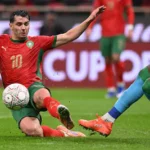 morocco-s-forward-10-brahim-diaz-fights-for-the-ball-with-comoros-s-goalkeeper-16-yannick-pandor-dur.webp
