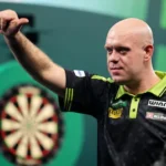netherland-s-michael-van-gerwen-celebrates-defeating-germany-s-arno-merk-on-day-fifteen-of-the-world.webp