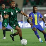 nigeria-s-forward-17-alex-iwobi-and-tanzania-s-midfielder-08-charles-m-mombwa-vie-during-the-africa.webp