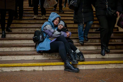 people-cover-in-a-metro-station-being-used-as-a-bomb-shelter-during-a-russian-drones-attack-in-kyiv.webp