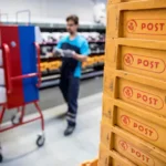 picture-taken-on-may-23-2019-shows-an-employee-of-danish-postal-service-postnord-working-at-the-comp.webp