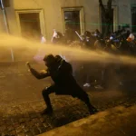 topshot-police-officers-use-water-cannons-to-desperse-demonstrators-during-clashes-as-part-of-a-prot.webp