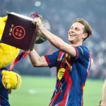 barcelona-s-dutch-midfielder-21-frenkie-de-jong-celebrates-with-the-trophy-after-winning-the-spanish.webp