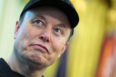 file-elon-musk-listens-as-president-donald-trump-speaks-during-a-news-conference-in-the-oval-office.webp