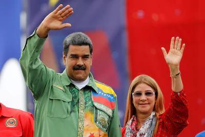 file-photo-venezuela-s-president-nicolas-maduro-and-his-wife-cilia-flores-greet-supporters-during-hi.webp