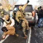 ice-and-other-federal-officers-detain-a-person-during-protests-as-ice-operates-in-a-residential-neig.jpeg