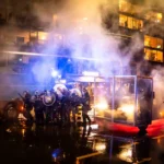 riot-police-clash-with-protesters-fire-water-cannons-and-tear-gas-after-a-rally-against-the-world-ec.webp