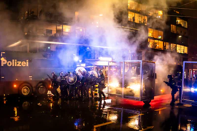 riot-police-clash-with-protesters-fire-water-cannons-and-tear-gas-after-a-rally-against-the-world-ec.webp