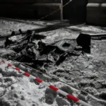russian-drone-debris-is-in-the-snow-near-an-apartment-block-during-an-attack-on-zaporizhzhia-ukraine.webp
