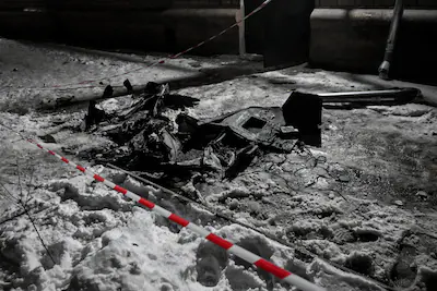 russian-drone-debris-is-in-the-snow-near-an-apartment-block-during-an-attack-on-zaporizhzhia-ukraine.webp