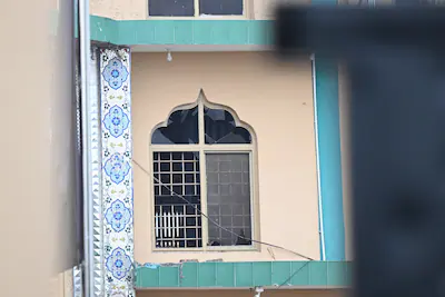 a-broken-window-is-seen-in-a-mosque-where-an-explosion-took-place-in-islamabad-capital-of-pakistan-o.webp