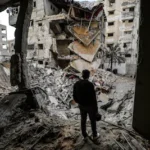 a-palestinian-checks-the-damaged-buildings-following-israeli-airstrikes-in-gaza-city-on-january-31-2.webp