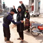 epaselect-epa12781217-pakistani-security-officials-check-people-and-vehicles-at-a-checkpoint-in-pesh.webp