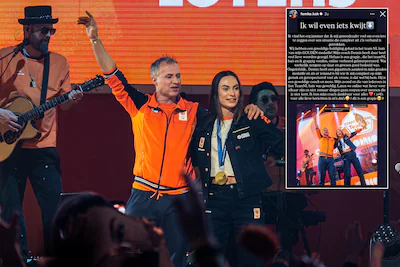 femke-kok-en-dennis-van-der-gun-op-het-podium-van-het-teamnl-huis.webp