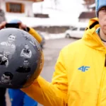 ukraine-s-skeleton-racer-vladyslav-heraskevych-holds-his-helmet-which-depicts-victims-of-his-country.webp