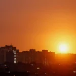 an-explosion-of-a-missile-lights-up-the-sky-over-the-city-during-a-russian-missile-and-drone-strike.webp