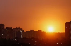 an-explosion-of-a-missile-lights-up-the-sky-over-the-city-during-a-russian-missile-and-drone-strike.webp