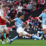 manchester-city-s-nathan-ake-right-clears-the-ball-from-arsenal-s-viktor-gyoekeres-during-the-englis.webp