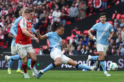 manchester-city-s-nathan-ake-right-clears-the-ball-from-arsenal-s-viktor-gyoekeres-during-the-englis.webp