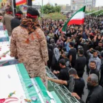 people-attend-the-funeral-of-the-victims-following-an-israeli-strike-on-a-school-in-minab-iran-march.webp