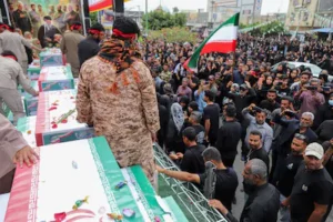 people-attend-the-funeral-of-the-victims-following-an-israeli-strike-on-a-school-in-minab-iran-march.webp