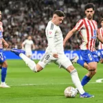 real-madrid-s-uruguayan-midfielder-08-federico-valverde-is-challenged-by-atletico-madrid-s-us-midfie.webp