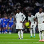 real-madrid-s-vinicius-junior-reacts-as-getafe-s-satriano-celebrates-with-team-mates-the-opening-goa.webp