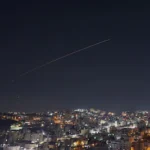 rocket-trails-are-seen-in-the-sky-above-the-city-of-hebron-in-the-israeli-occupied-west-bank-amid-a.webp