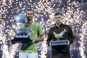 russia-s-daniil-medvedev-l-and-runner-up-netherlands-tallon-griekspoor-poses-pose-with-their-trophie.webp