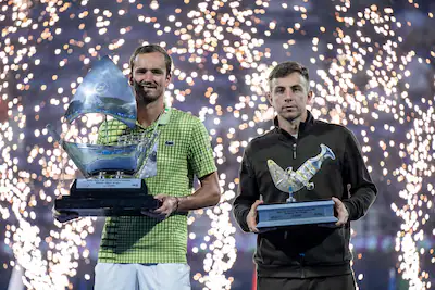 russia-s-daniil-medvedev-l-and-runner-up-netherlands-tallon-griekspoor-poses-pose-with-their-trophie.webp