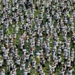 this-aerial-view-shows-some-of-the-thousands-of-attendees-to-a-world-class-football-clinic-at-the-zo.webp
