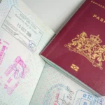dutch-passport-with-stamps-from-diferent-countrys-like-new-zealand-peru-and-usa-new-york.webp