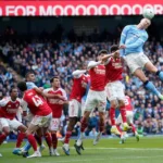 manchester-city-s-erling-haaland-heads-the-ball-during-the-english-premier-league-soccer-match-betwe.webp