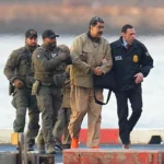 new-york-ny-january-5-nicolas-maduro-and-his-wife-cilia-flores-are-seen-in-handcuffs-after-landing-a.webp