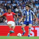 nottingham-forest-s-dan-ndoye-left-passes-the-ball-in-front-of-porto-s-martim-fernandes-during-the-e.webp
