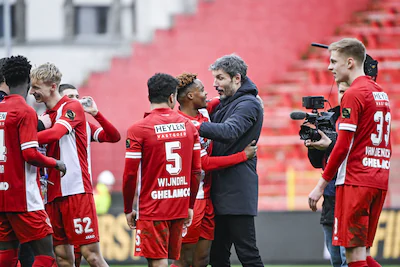 antwerp-s-victor-udoh-and-antwerp-s-head-coach-mark-van-bommel-celebrate-after-winning-a-soccer-matc.webp
