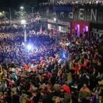 arsenal-supporters-gather-to-celebrate-at-the-arsenal-stadium-after-arsenal-s-soccer-team-won-the-pr.webp
