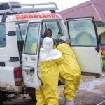 congolese-health-workers-receive-a-patient-at-the-rwampara-general-hospital-as-authorities-intensify.jpeg