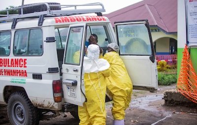 congolese-health-workers-receive-a-patient-at-the-rwampara-general-hospital-as-authorities-intensify.jpeg