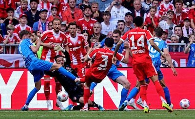 epa12928068-min-jae-kim-of-munich-r-in-action-against-goalkeeper-diant-ramaj-of-heidenheim-l-during.jpeg