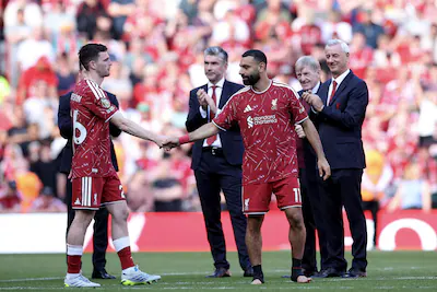 epa12991223-liverpool-s-andy-robertson-l-and-mohamed-salah-r-react-after-their-final-match-in-a-live.webp