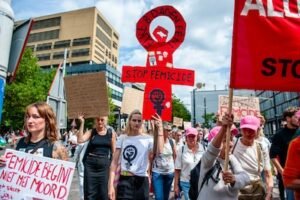 rotterdam-netherlands-2025-08-03-a-protester-holds-a-big-gender-symbol-of-women-with-words-stop-femi.jpeg