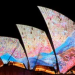 sydney-australia-may-22-the-sails-of-the-sydney-opera-house-are-illuminated-with-lights-on-the-openi.webp