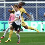england-s-forward-18-anthony-gordon-l-fights-for-the-ball-with-ghana-s-forward-11-antoine-semenyo-du.webp