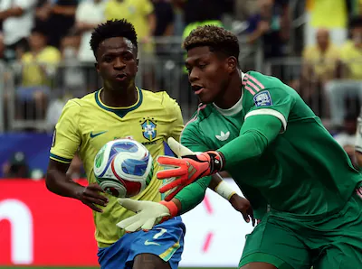 epa13073120-vinicius-junior-of-brazil-l-and-goalkeeper-zion-suzuki-of-japan-in-action-during-the-fif.webp
