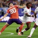 scotland-s-forward-20-lawrence-shankland-and-haiti-s-midfielder-10-jean-ricner-bellegarde-fight-for.webp